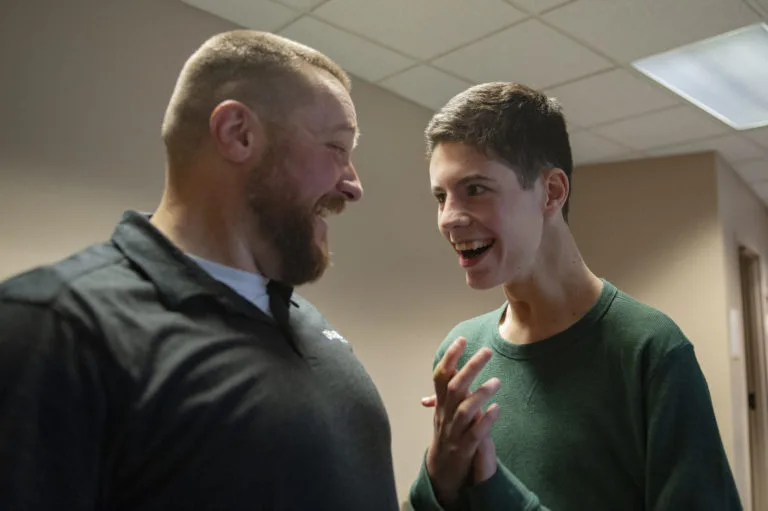Two friends laughing together